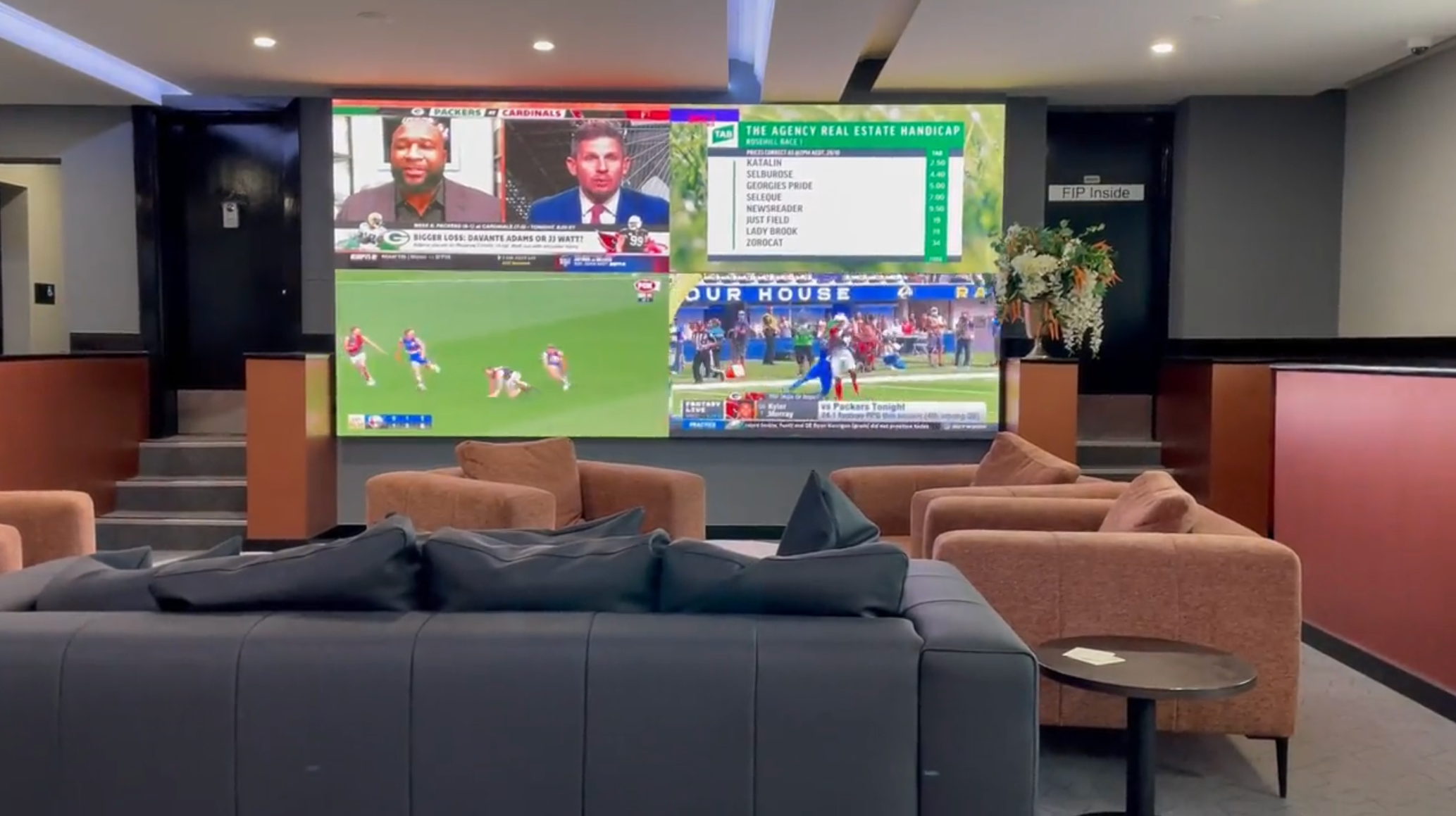 Sports bar LED videowall with multiple screens showing live sport